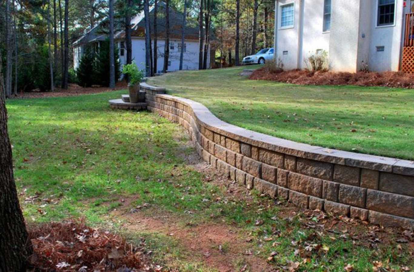 A FARE Outdoor Construction worker building a retaining wall in Hoover, AL.